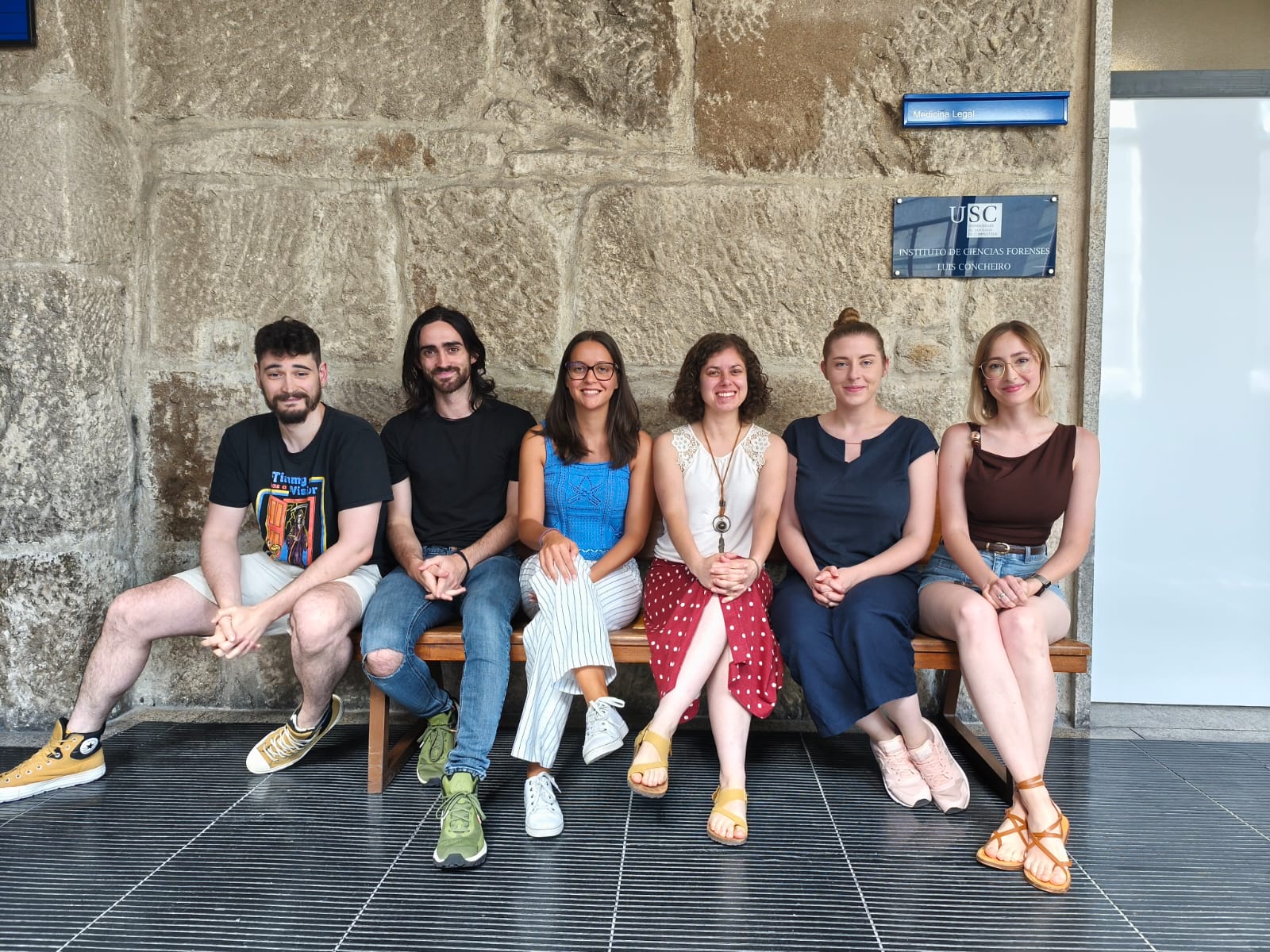 ForMAT and USC researchers seated together outside the Forensic Genetics Institute in Santiago de Compostela.
